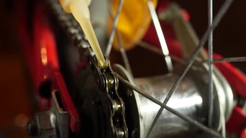 67. Lubricate the bicycle chain with oil. Bicycle maintenance and care.