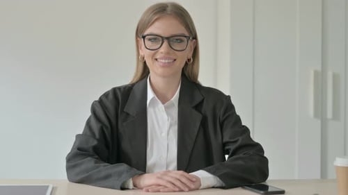 Successful Young Businesswoman Smiling in Office