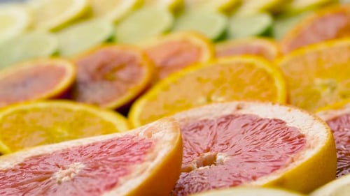 Food, Healthy Eating and Vegetarian Concept - Close Up of Grapefruit, Orange,