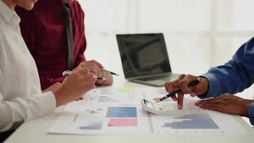 Close up of business hands are working and brainstorming on paperworks.