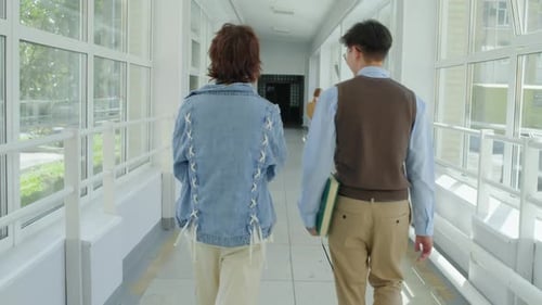 College Students Walking Long Corridor