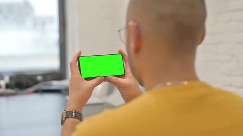 Holding Phone Horizontal with Green Screen