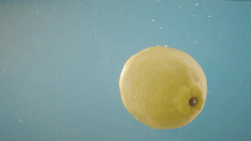 Lemon in Water with Bubbles