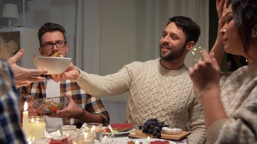 Friends Gather, Eating, Talking, and Sharing Festive Meal