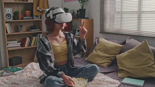 Teen Wearing VR Headset Using Hand Gestures