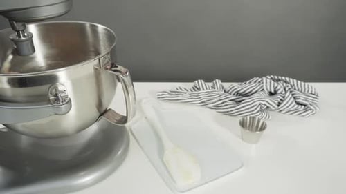 Mixing Ingredients in a Kitchen Standing Mixer to Bake Cinnamon Rolls