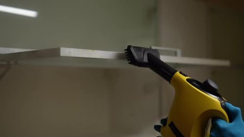 Steam Cleaner Cleans Edge of Shelf