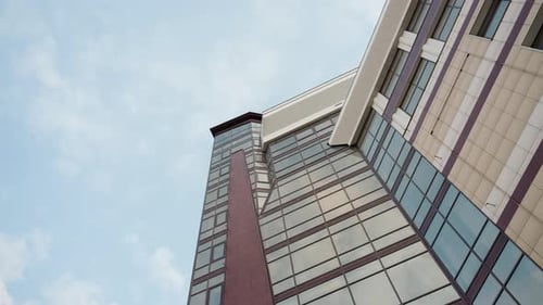 Modern GlassFaced City Building with Clear Sky