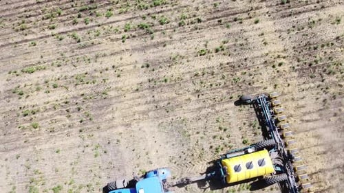 Blue Tractor O.A. Planting Canola On No Till Field