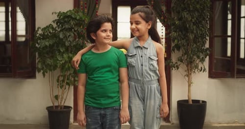 Portrait of Two Little Cute Indian Kids Posing Together in Their Home. Brother and Sisters Happil