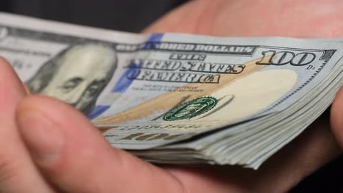 Stack of Money Riffled Through