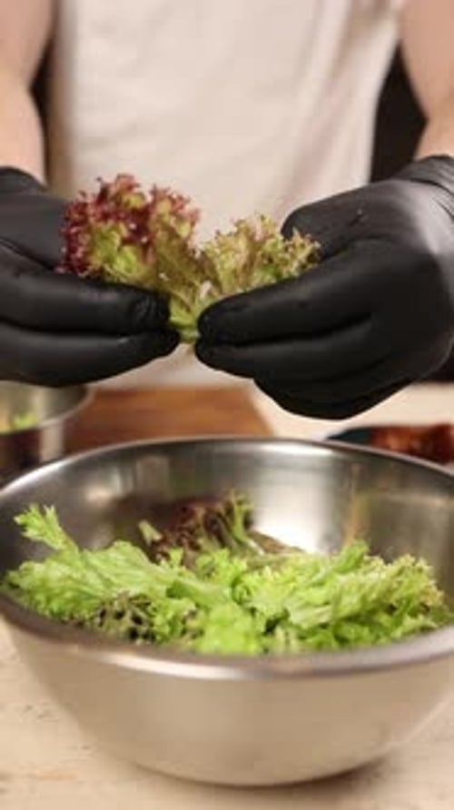 Chef prepares a delicious salad in a restaurant