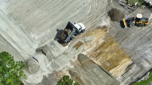 Earth Moving Tractor Preparing Place for Future House Foundation Construction Leveling Soil for