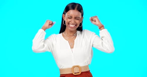 Woman Cheers in Triumph Against Cyan Background