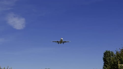 Passenger Airplane Flying Overhead During the Daytime