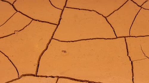 Cracked Soil in a Desert Drying Out in Timelapse. Ground Draining, Cracked Earth, Global Warming