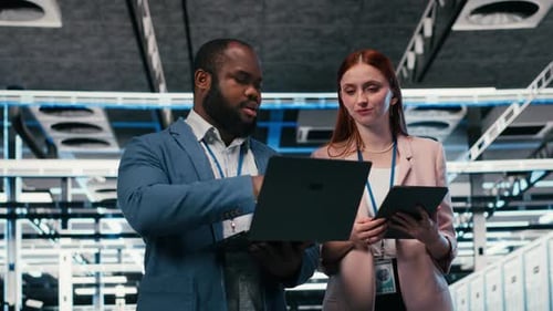 Teamwork in Data Center with Laptop and Tablet