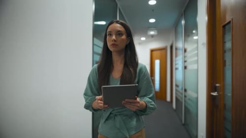 Woman Ceo Searching Tablet Computer in Office