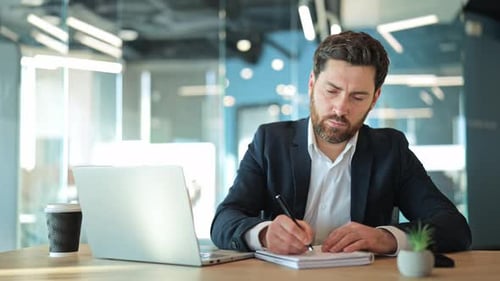 Focused Business Professional Working at Office Desk