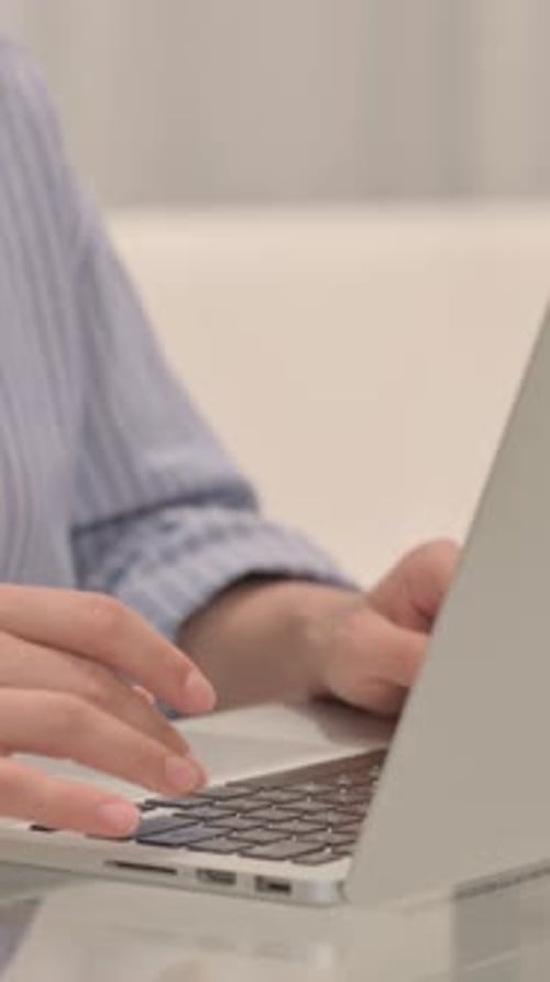 Close Up of Businesswoman Typing on Laptop, vertical