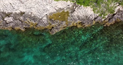 Turquoise Blue Waters And Rocky Coastline Of Island In Croatia. - aerial overhead shot