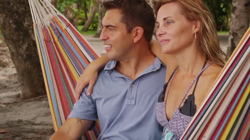 Couple Sitting Together in Hammock at Beach Costa Rica America