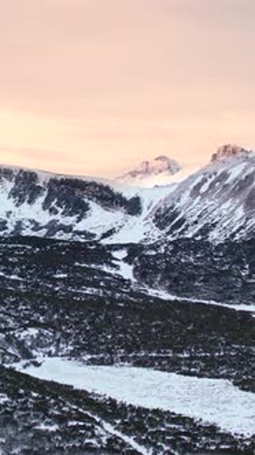 Aerial Winter Drone Footage of Snow Mountain Range Landscape in Alps