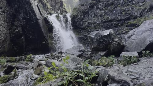 Waterfall Flowing Over Rocks in a Natural Setting