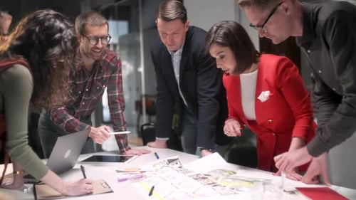 Business Team Collaborating on Project in Modern Office