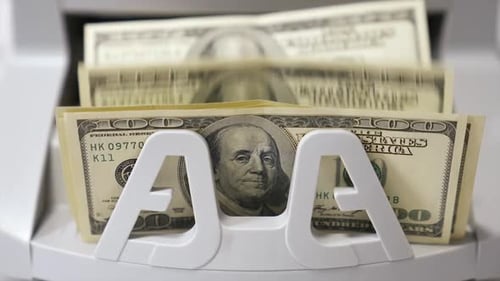 Counting process of dollar banknotes. Automated financial operations.