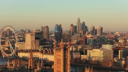 Golden Hour Illuminating Central London Cityscape Featuring the Houses of Parliament Big Ben