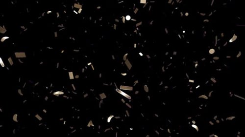 Scattered Metallic Fragments on Black Background