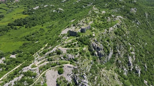 Aerial View of an Old Fortress Standing on Top of a Mountain in Europe