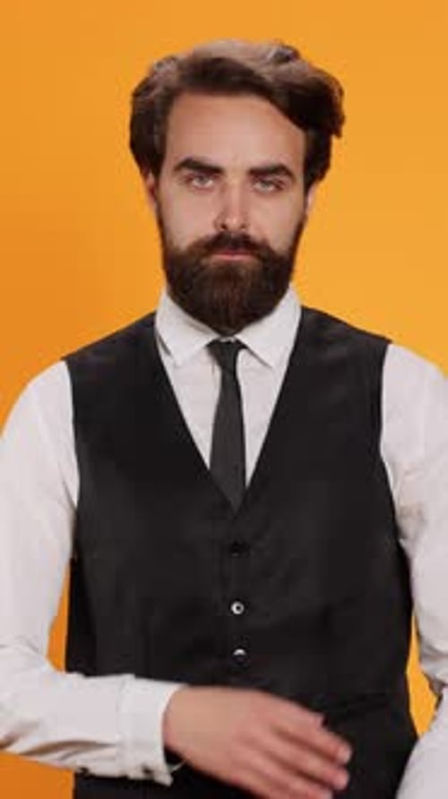 Vertical Video Elegant Waiter Poses with Reliability