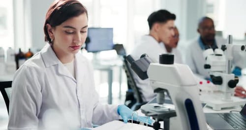 Scientist Reviews Data in Bright Modern Lab