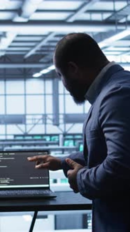 Vertical Video Team of Engineers in Data Center Doing Brainstorming to Fix Problems