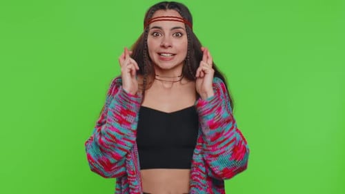 Excited Woman Crossing Fingers in Celebration on Green Screen