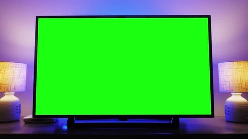 LcD Smart TV Screen with a Blank Green Background in the Living Room Chroma Key Screen for