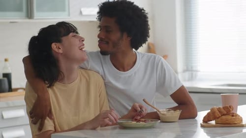 Loving Couple Enjoying Breakfast Together at Home