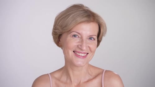 Smiling Woman with Blonde Hair Looking at Camera