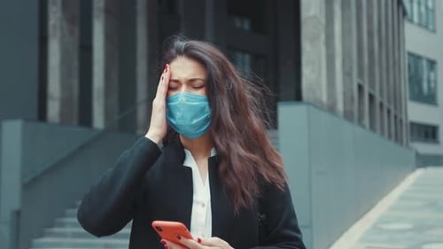 Woman in Mask Feels Pain Outside Office