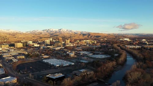 Orbiting aerial shot of downtown Boise, Idaho at sunrise.