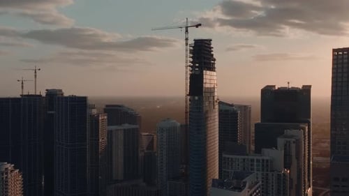 Cinematic view on sunset light and golden clouds over the modern business area in Brickell city. 4K