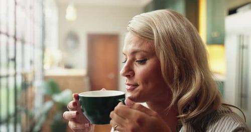 Woman Enjoys Aromatic Coffee in Bright Home