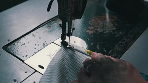 Operating a Vintage Sewing Machine Close Up