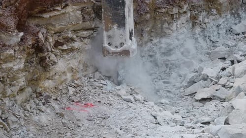 4K Slow Motion Jackhammer Breaking Large Rocks