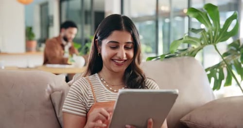 Typing, smile and tablet with woman on sofa for social media post, reading and online update