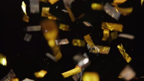 Close-up Shot Of Falling Golden Confetti