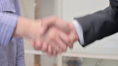 Close Up of Hand Shake by Business People