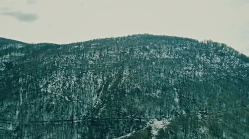 Aerial View of Snow Dusted Mountain and Trees
